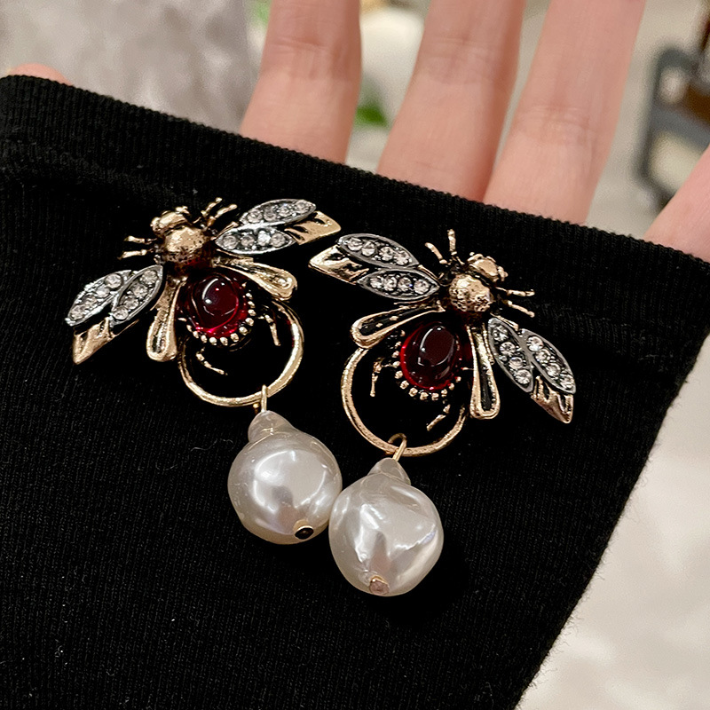 Boucles d'oreilles pendantes V - Vintage Fashion Bug avis et prix