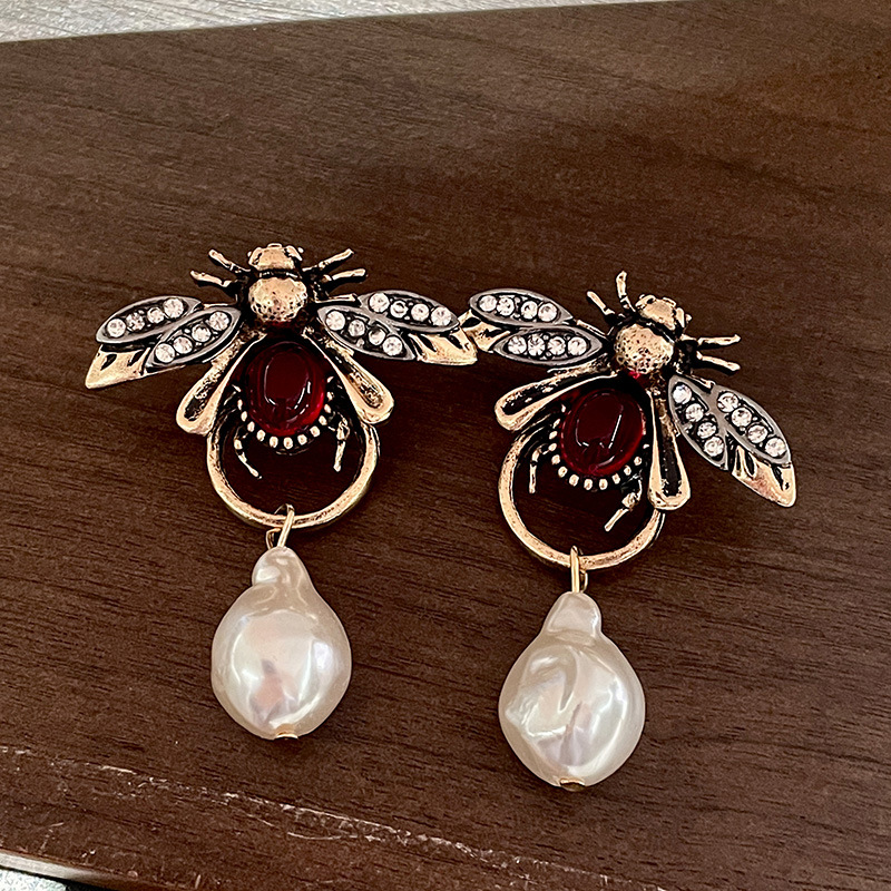 Boucles d'oreilles pendantes V - Vintage Fashion Bug avis et prix