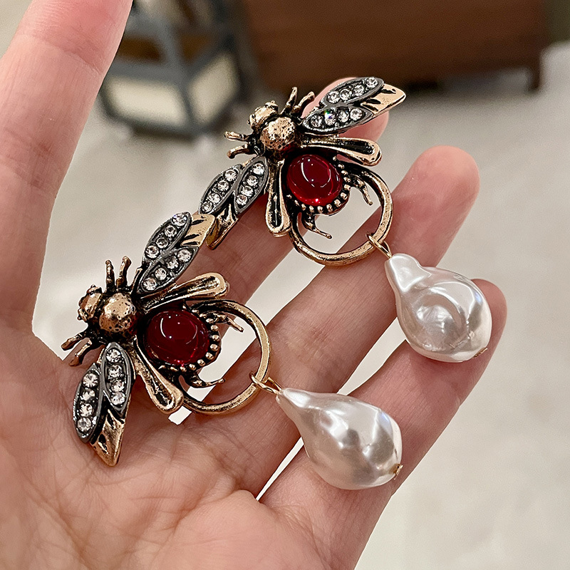 Boucles d'oreilles pendantes V - Vintage Fashion Bug avis et prix
